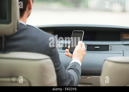 Using smartphone while driving Stock Photo