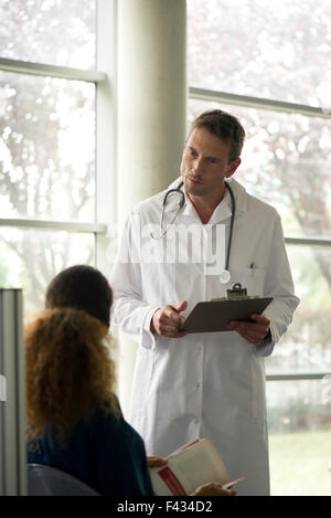 Doctor talking with patient Stock Photo