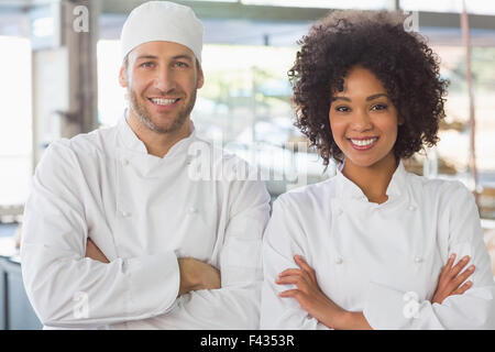 Team of bakers smiling at camera Stock Photo