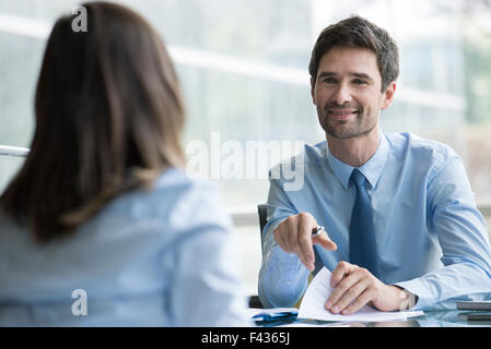 Insurance agent meeting with prospective customer Stock Photo