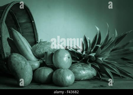 Fruits in green tones on the wooden floor. Stock Photo