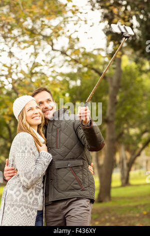 Smiling young couple taking selfies Stock Photo