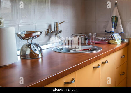 Close up photo of orange kitchen interior Stock Photo