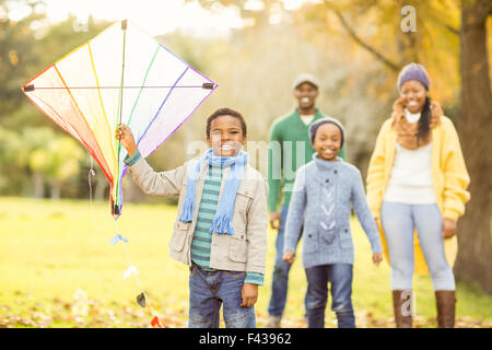 Young family playing with a kite Stock Photo