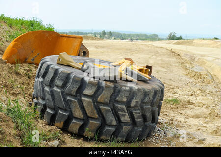 Spare tire with tool at construction site Stock Photo