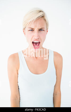 Angry blonde woman screaming Stock Photo