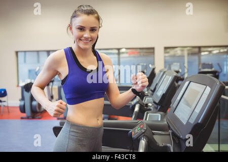 Fit woman using the treadmill Stock Photo