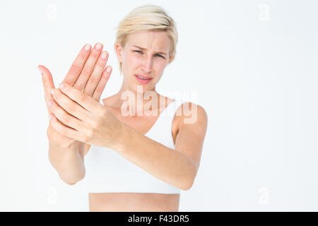 Pretty woman suffering from hand pain Stock Photo