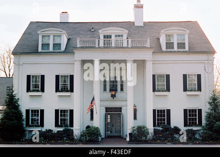 An elegant late 18th century mansion, facade with pillars and grand entrance. A hotel and restaurant. Stock Photo