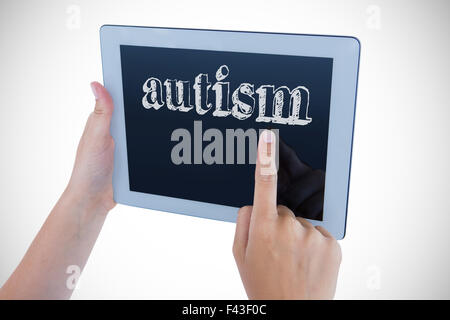 Autism against woman using tablet pc Stock Photo