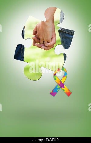 Composite image of two friends holding hands Stock Photo