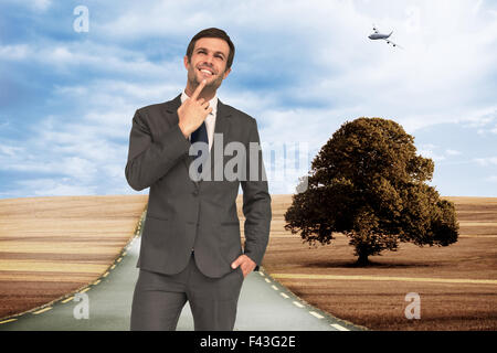 Composite image of thinking businessman Stock Photo