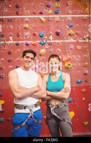 Fit couple at the rock climbing wall Stock Photo