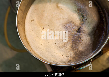 Froth of Home-Brew Mash in a Stock Pot While Sparging the water to Drain the Sugar Stock Photo