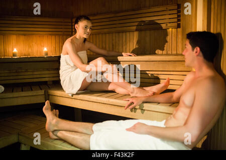 Couple relaxing in the sauna Stock Photo