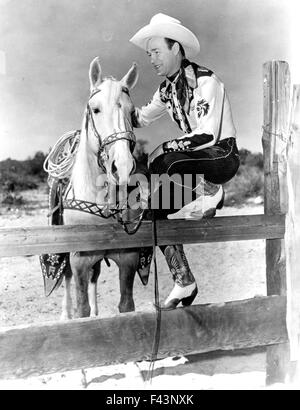 ROY ROGERS (1911-1998) US singer and cowboy film actor with his horse ...