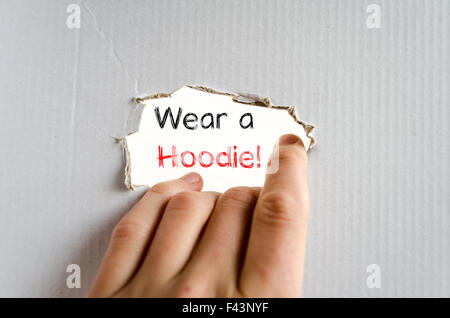 Wear a hoodie text concept isolated over white background Stock Photo