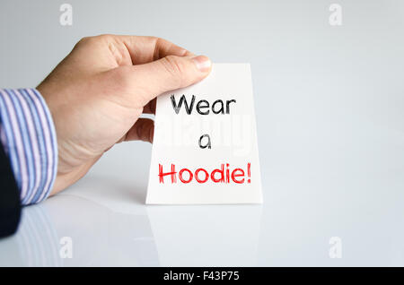 Wear a hoodie text concept isolated over white background Stock Photo