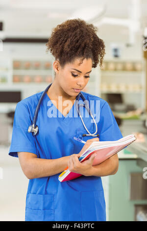 Young medical student taking notes Stock Photo