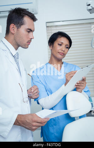 Dentists discussing reports Stock Photo