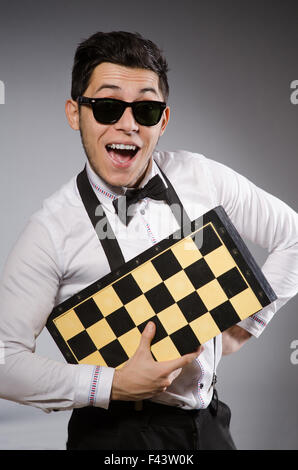 Funny chess player with board Stock Photo