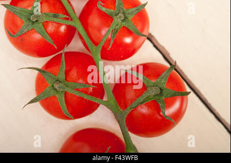 fresh cherry tomatoes on a cluster Stock Photo