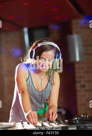 Pretty dj playing techno music Stock Photo