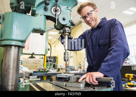 Engineering student using large drill Stock Photo