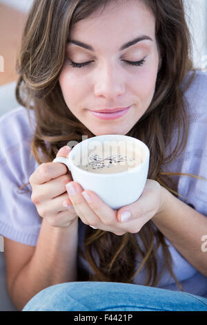 Pretty woman drinking cup of coffee Stock Photo