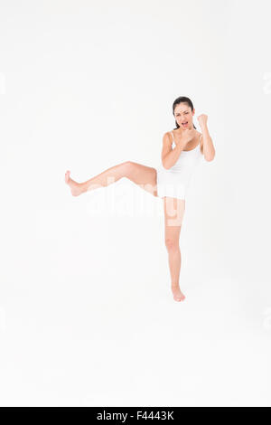 Fit woman practicing karate Stock Photo