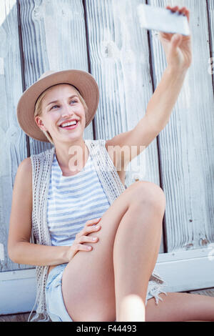 Pretty blonde woman taking selfie Stock Photo - Alamy