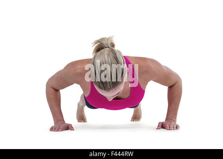Portrait of pretty woman doing push ups Stock Photo