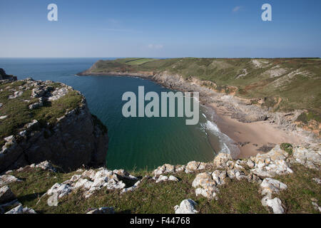 Steep cliffs and crystal clear water at Fall Bay, near Rhossili on the Gower peninsular south Wales Stock Photo