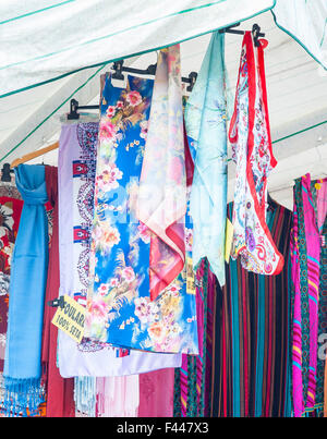 Shawl for women on sale at outdoor market. Italy Stock Photo
