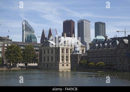The exterior of the Binnenhof, or Netherlands Parliament building in The Hague, as viewed over the Hofvijver lake and fountain. Stock Photo