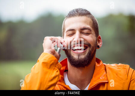 Man making a call on hike Stock Photo