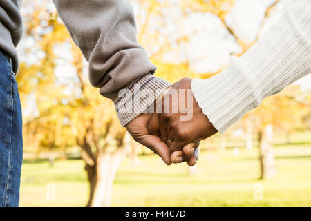 Close up view of senior couple holding hands Stock Photo