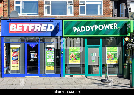 Betting shops next door to each other betting posters in windows in High Road between Seven Kings &Goodmayes near Ilford in Redbridge East London UK Stock Photo