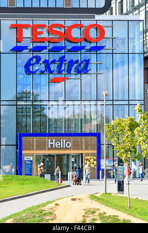 Tesco Extra supermarket store & hello sign over entrance to part of the large mixed use development at Woolwich Central South London England UK Stock Photo