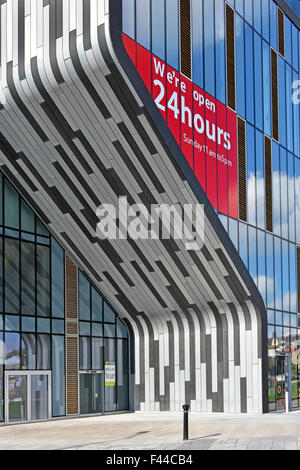 Open 24 hours sign & curved architectural feature on Tesco Extra supermarket store part of Woolwich Central development complex London England UK Stock Photo