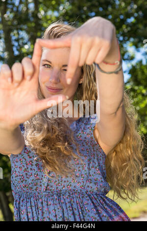 Pretty blonde framing with hands Stock Photo