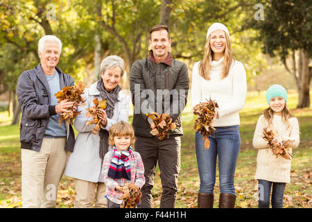 Extended family are ready to throw leaves around Stock Photo