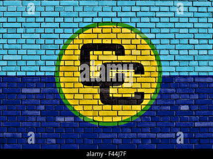 flag of CARICOM painted on brick wall Stock Photo