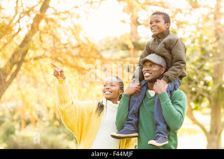 Young smiling family pointing something Stock Photo