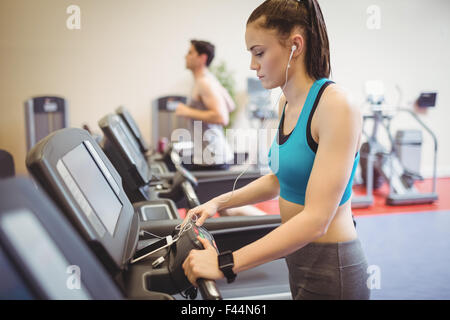 Fit woman using the treadmill Stock Photo