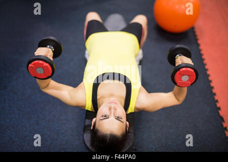 Woman working out with weights Stock Photo