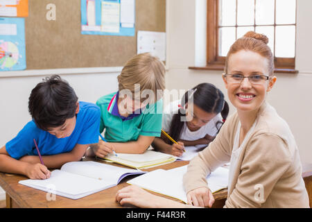 Thoughtful pupils working together Stock Photo - Alamy