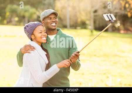 Young smiling couple taking selfies Stock Photo