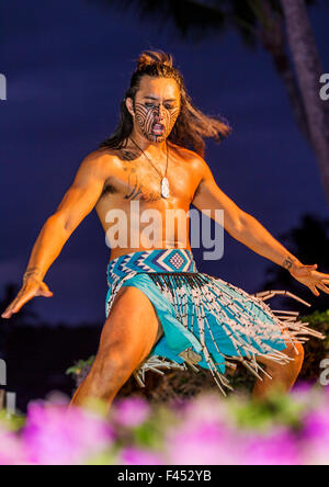 Native male Hawaiian performing traditional dance at Lua, Big Island, Hawai'i, USA Stock Photo