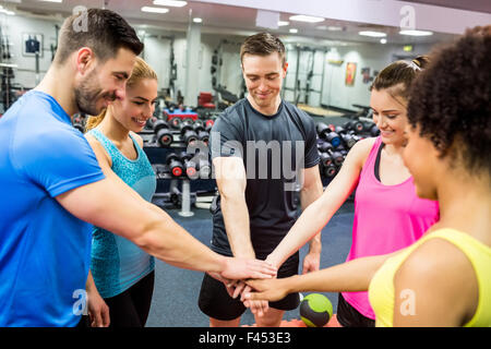 Fit people putting their hands together Stock Photo